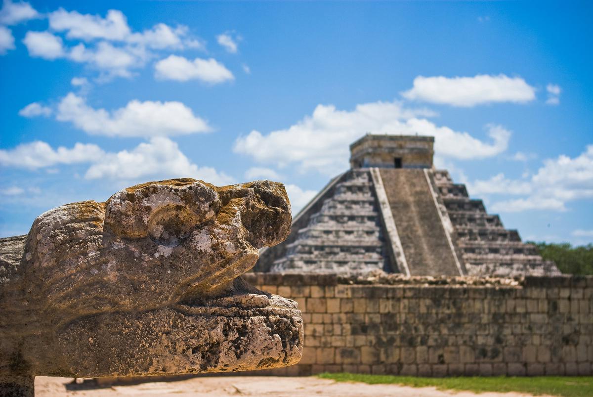 The ancient Mayan ruins of Chichen Itza in Mexico with the main pyramid structure visible